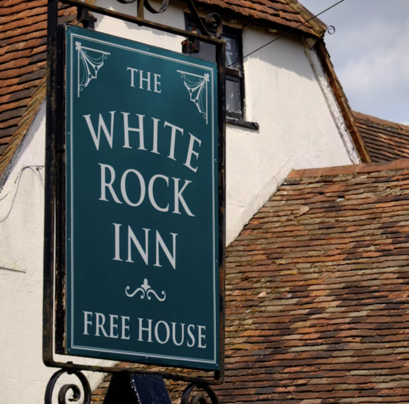 THE WHITE ROCK INN logo